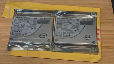 Picture of two HP enterprise SSDs in anti-static bags