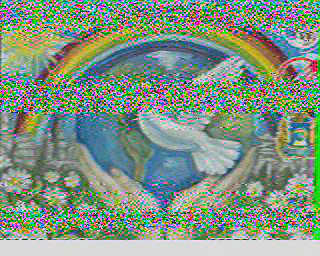 SSTV image of a rainbow and peace dove
